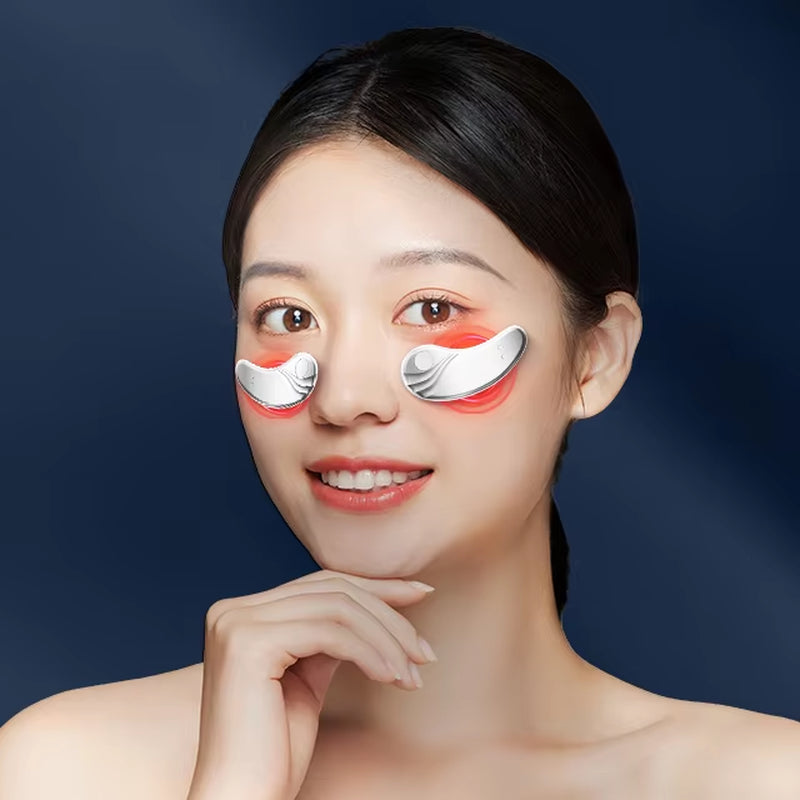Woman using GlowEyes™ Red Light Under-Eye Massager 01